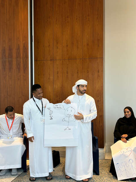 Participant presenting a flip chart drawing