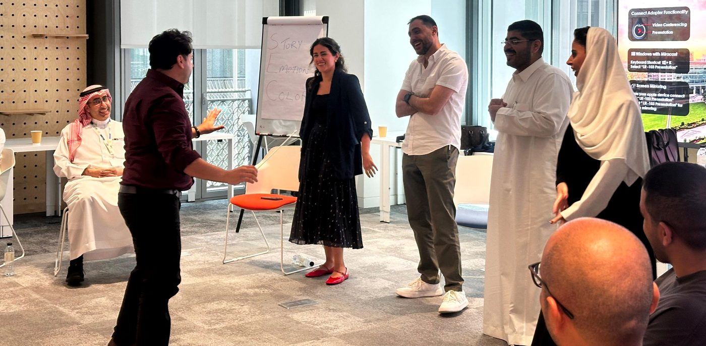 Salman Qureshi leading an improv exercise with participants