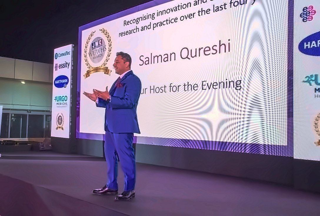 Salman Qureshi hosting an awards evening on stage